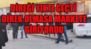 Otomobil markete girmek üzereyken telefon direğini yıkarak durdu